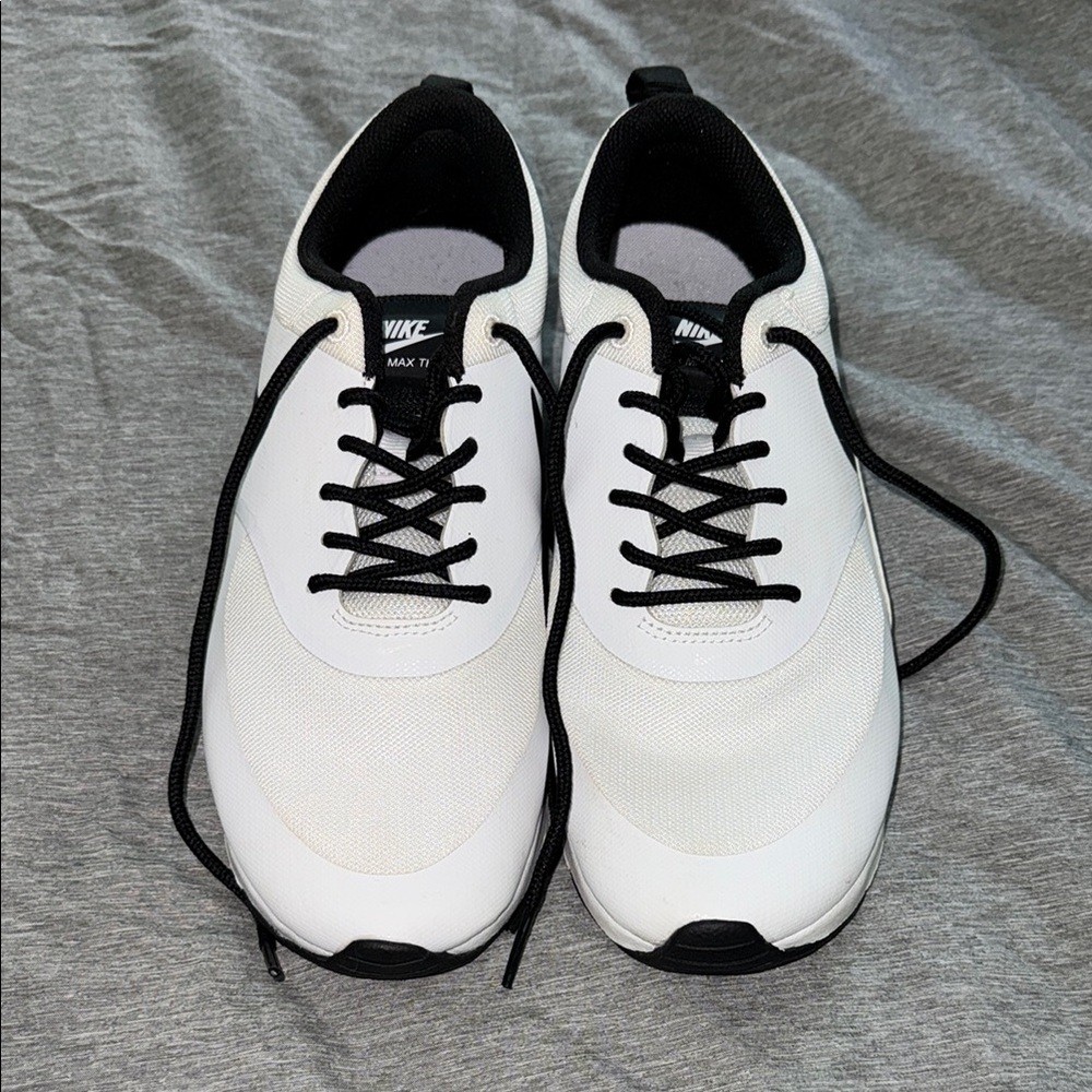 Nike White and Black Athletic Shoes with Modern Design